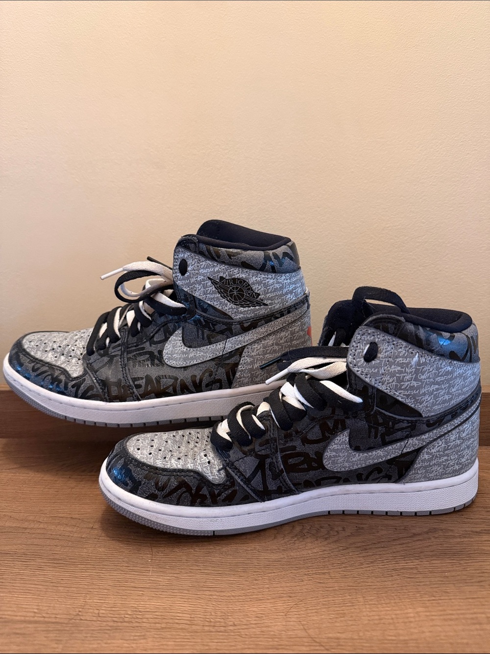 Nike men’s High-Top Sneakers in Black & Gray with Graffiti Print